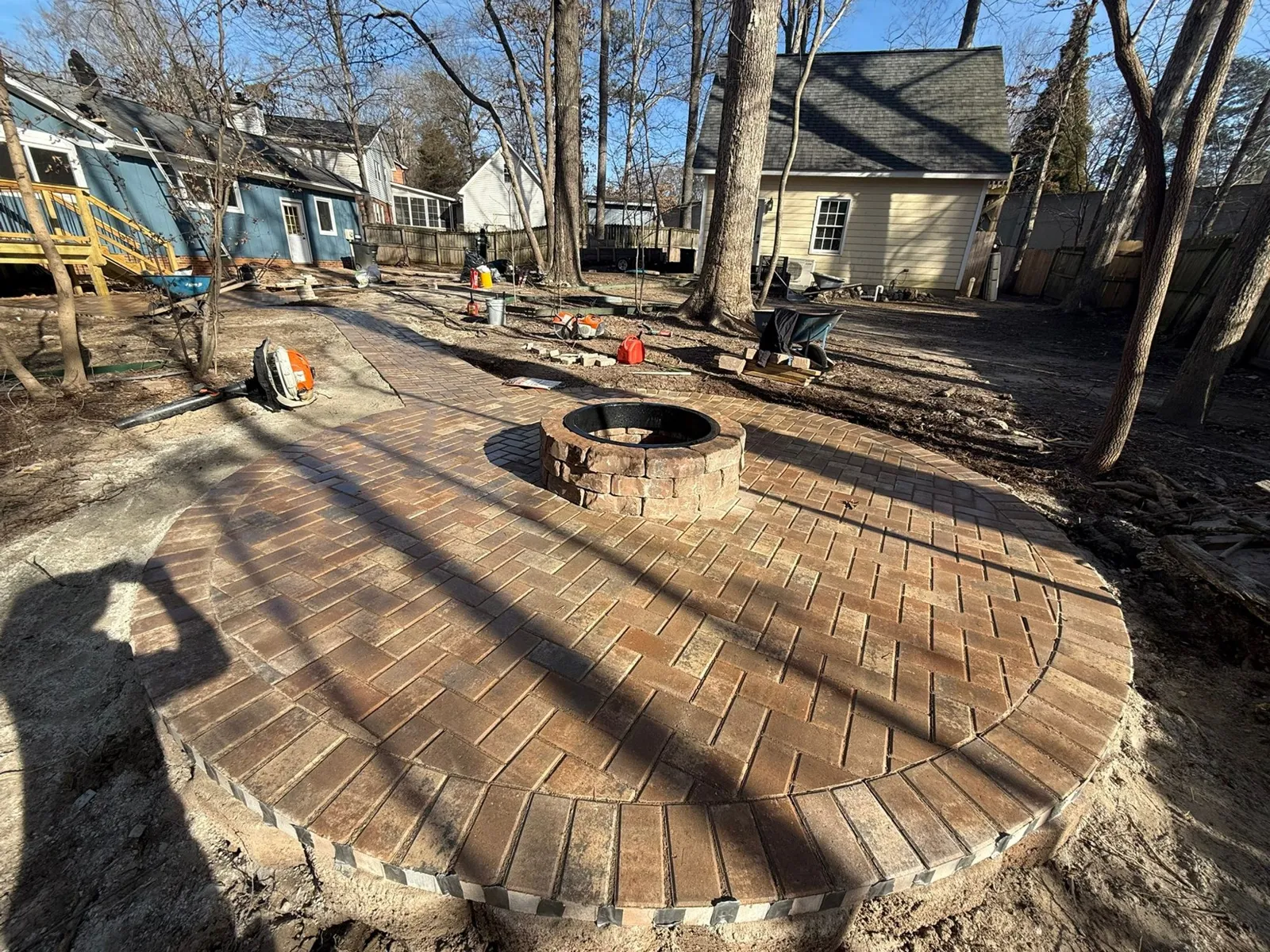 Fire Pit Installation project by Sam General Landscaping